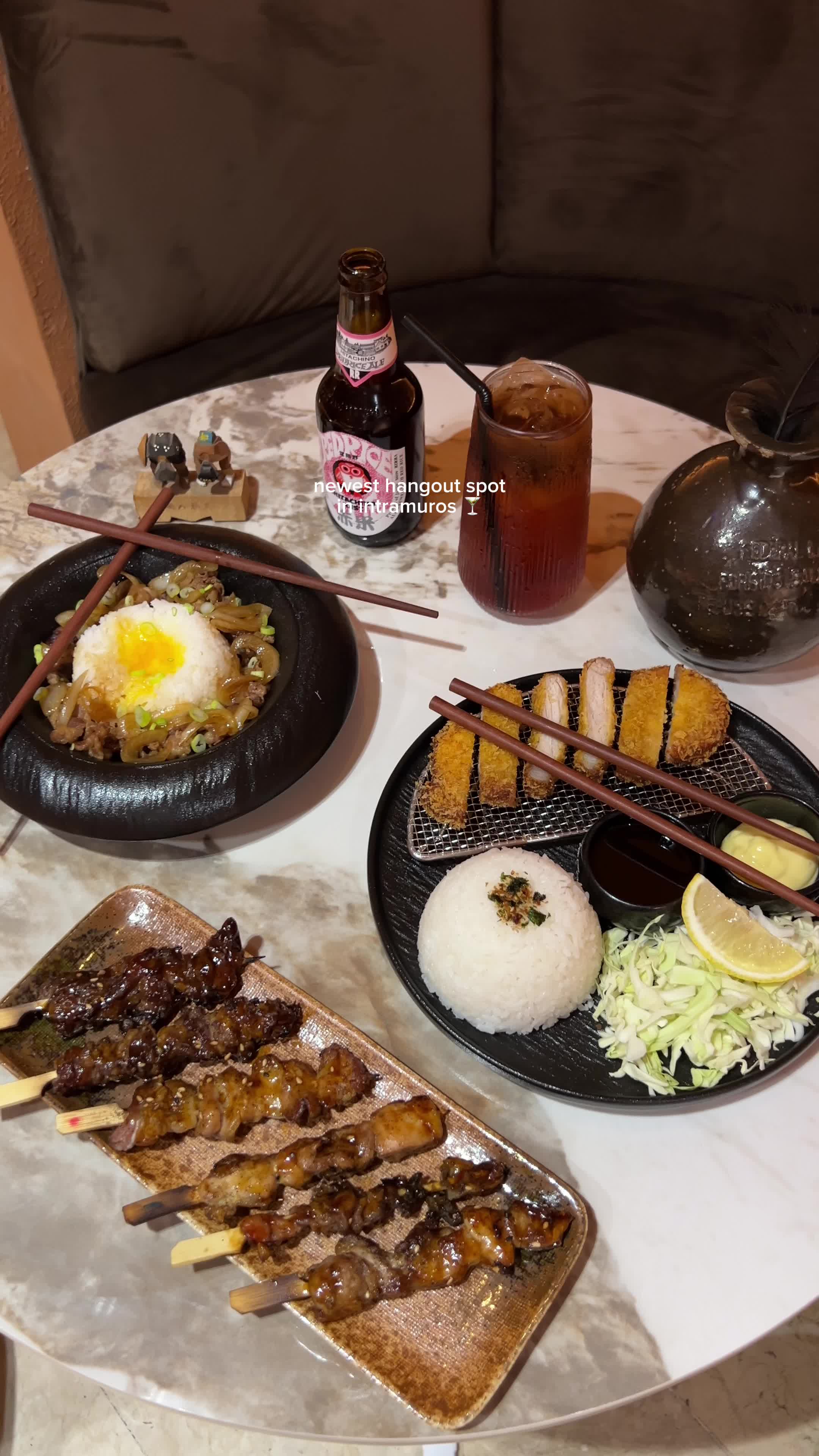 Japanese food spread with cocktails and hookah at Grotto Lounge