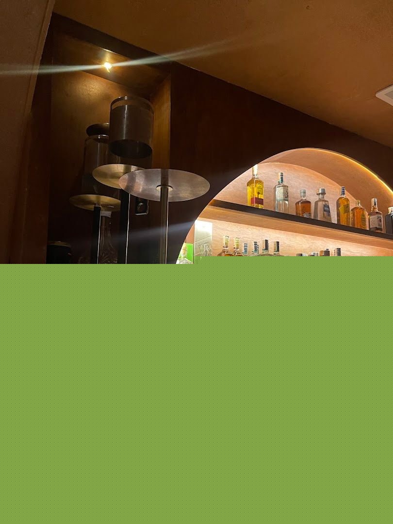 Grotto Hookah Lounge bar area with hookah pipes and premium spirits