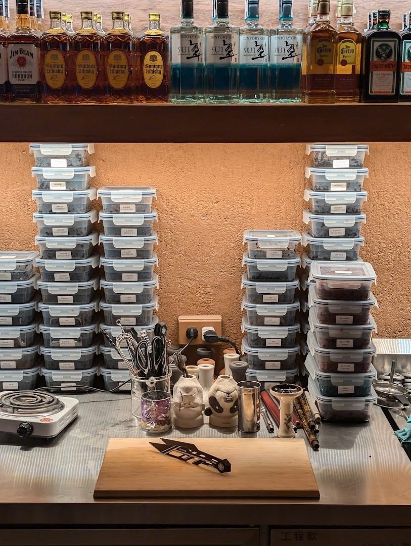 Shisha preparation station with flavor containers and bar tools