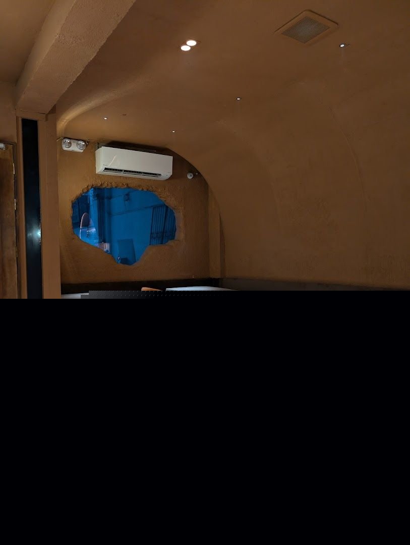Grotto Lounge interior with cave-inspired seating area